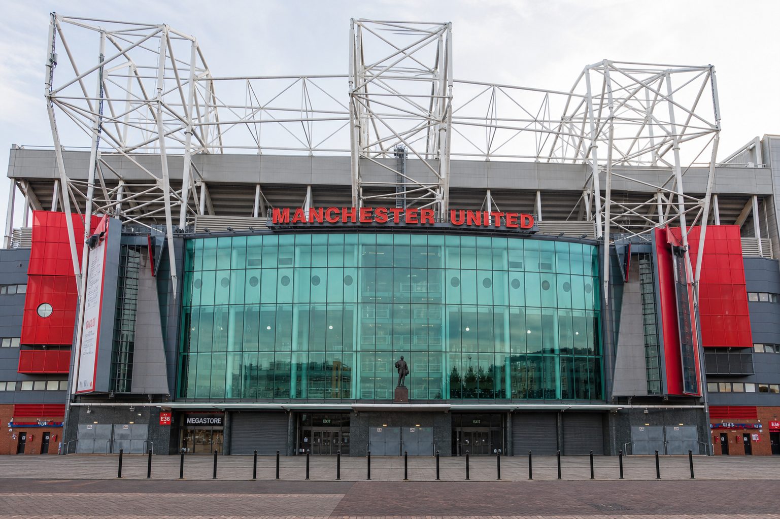 The front of Old Trafford, the Manchester United sign above the glass frontage
