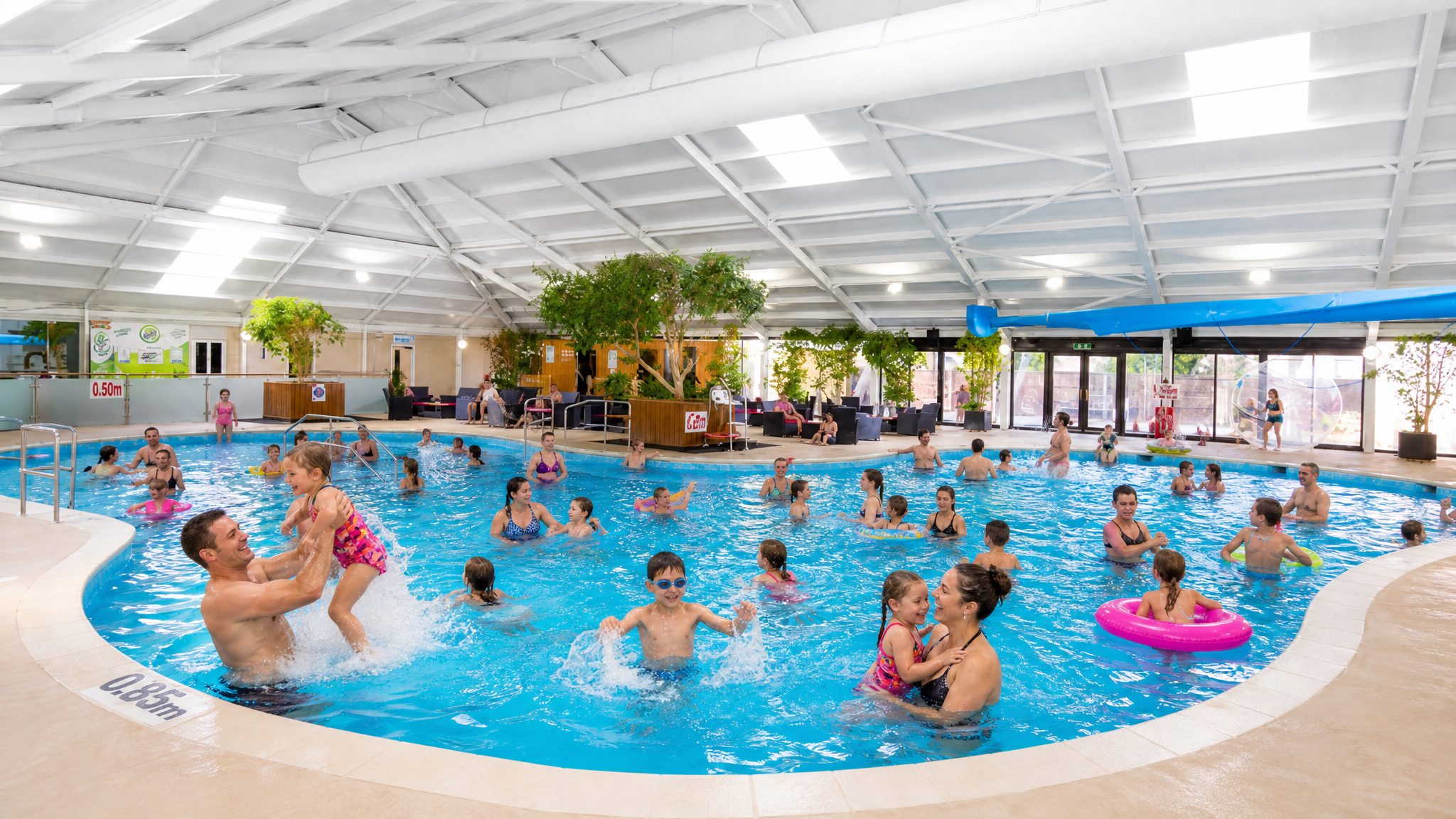 Families in the indoor pool at Talacre Beach Resort between matches